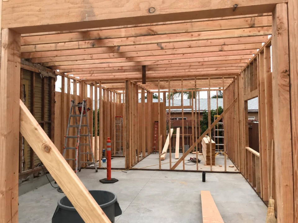 Timber wall and ceiling framing inside an attached ADU during construction