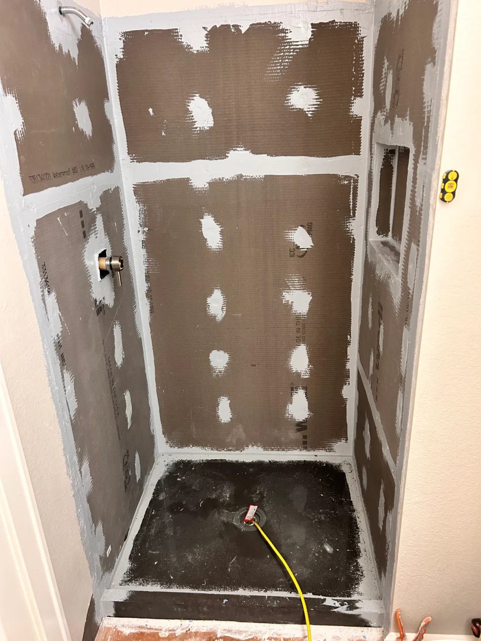 In progress: shower wall and base preparation