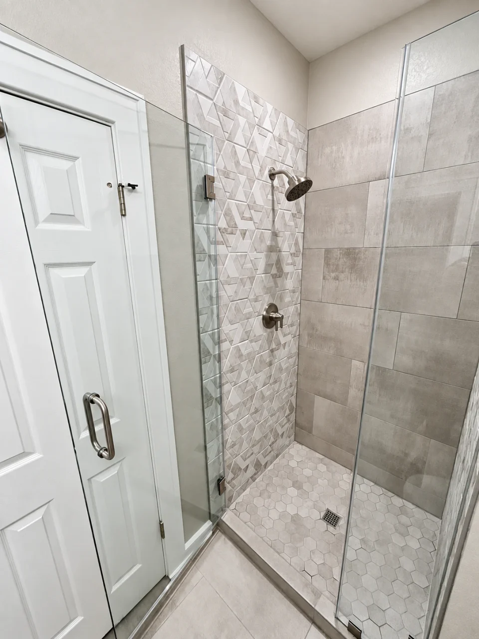 Finished shower: dimensional tile, fixtures and hexagonal floor