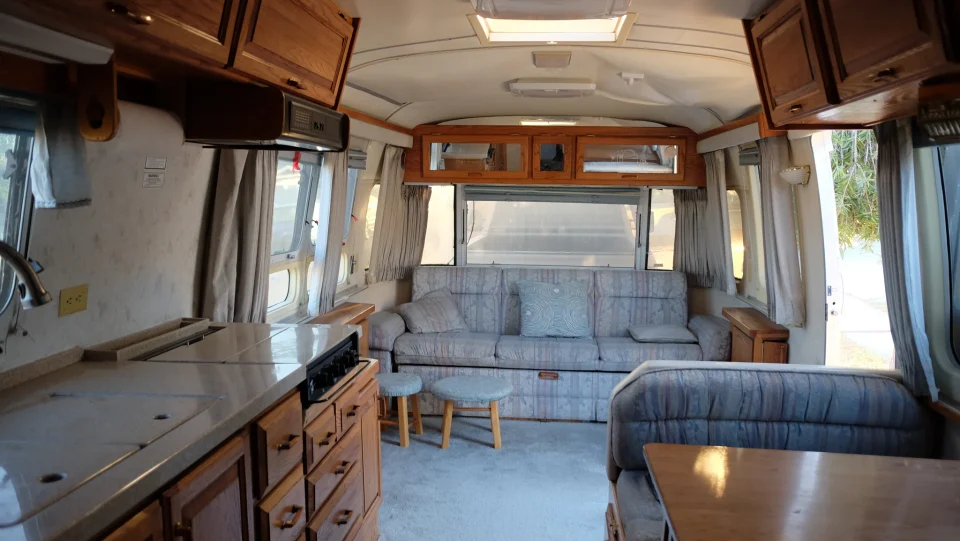 Before renovation: Airstream interior with wood cabinetry