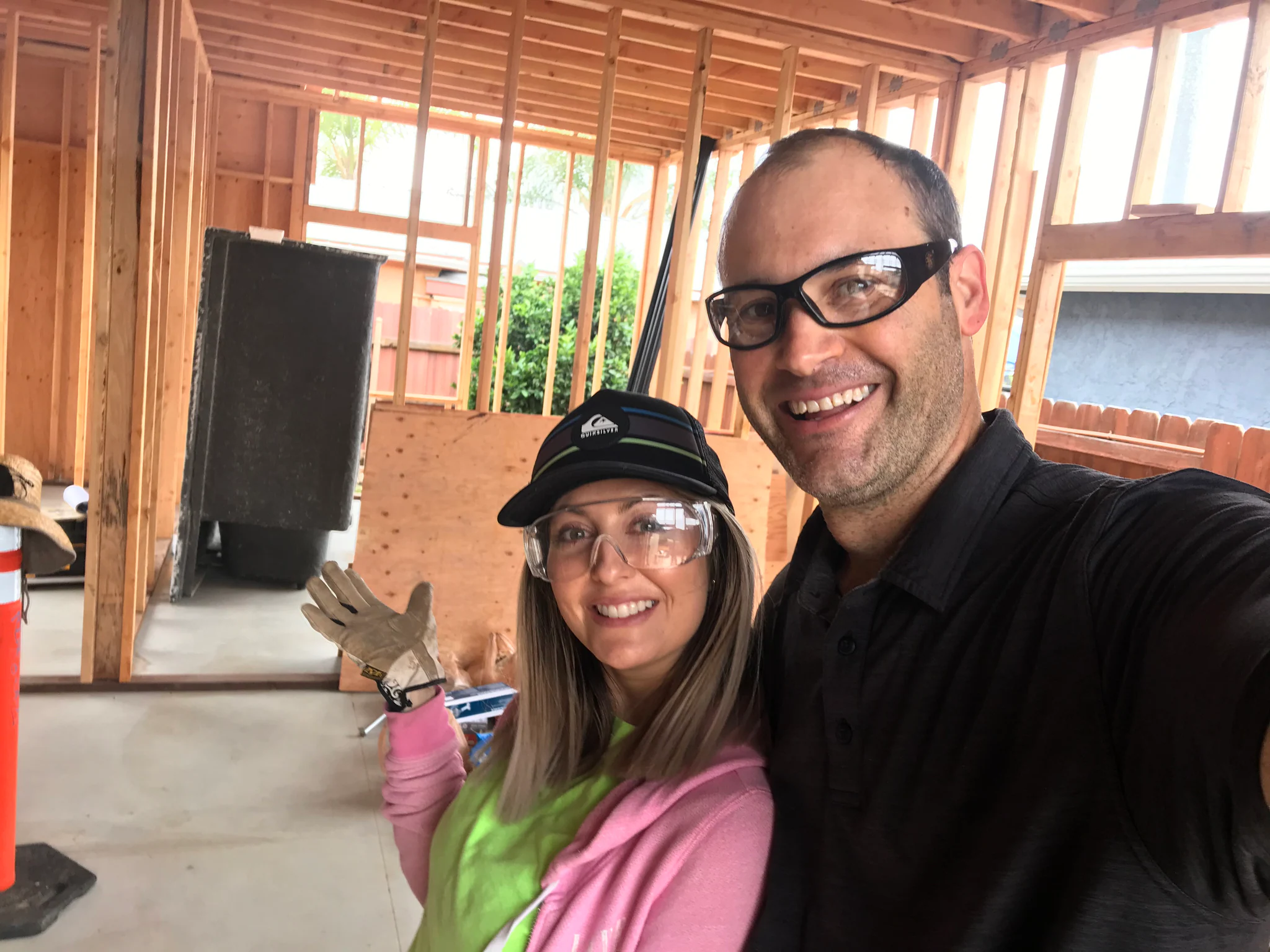 Jake and Bobbie inside the framing of an attached ADU project
