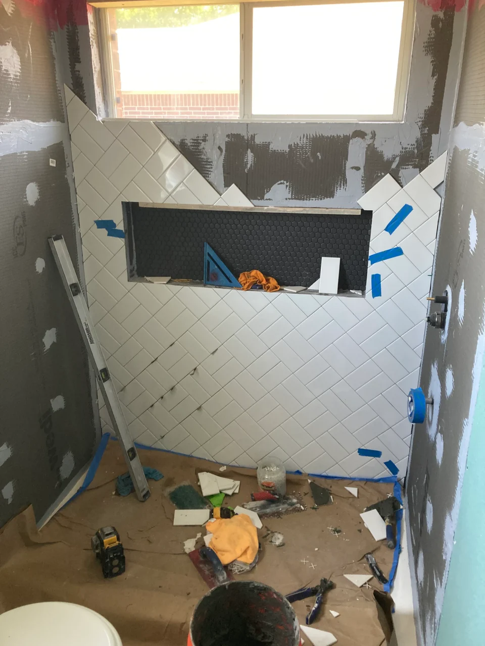 Basket-weave shower tile during installation