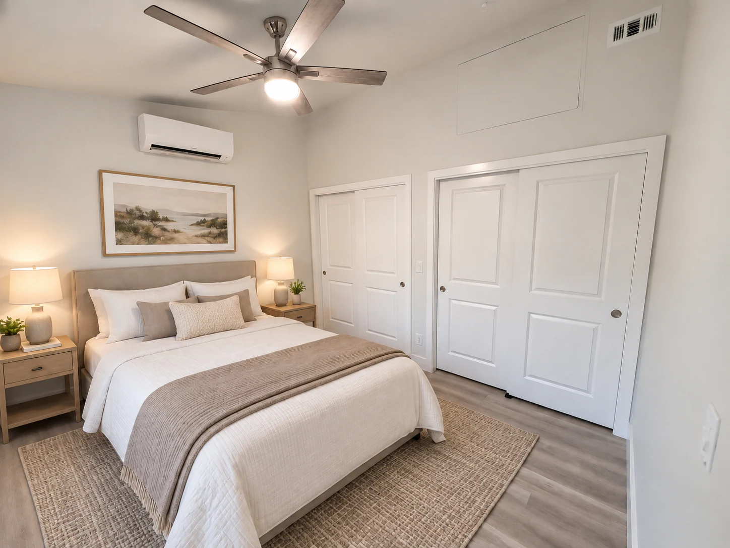 ADU bedroom with a bed beneath a ceiling fan