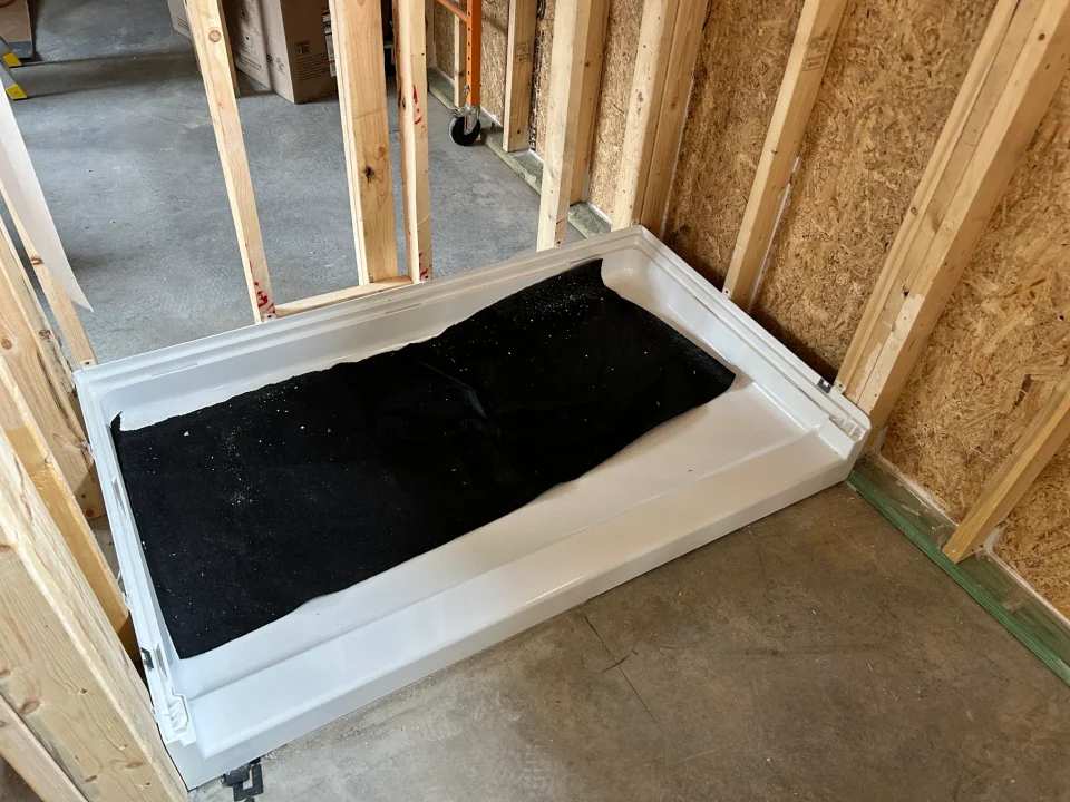 ADU shower base protected during construction