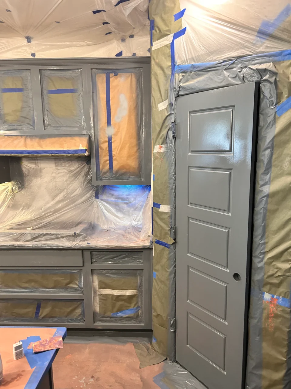 Kitchen cabinets masked during refinishing