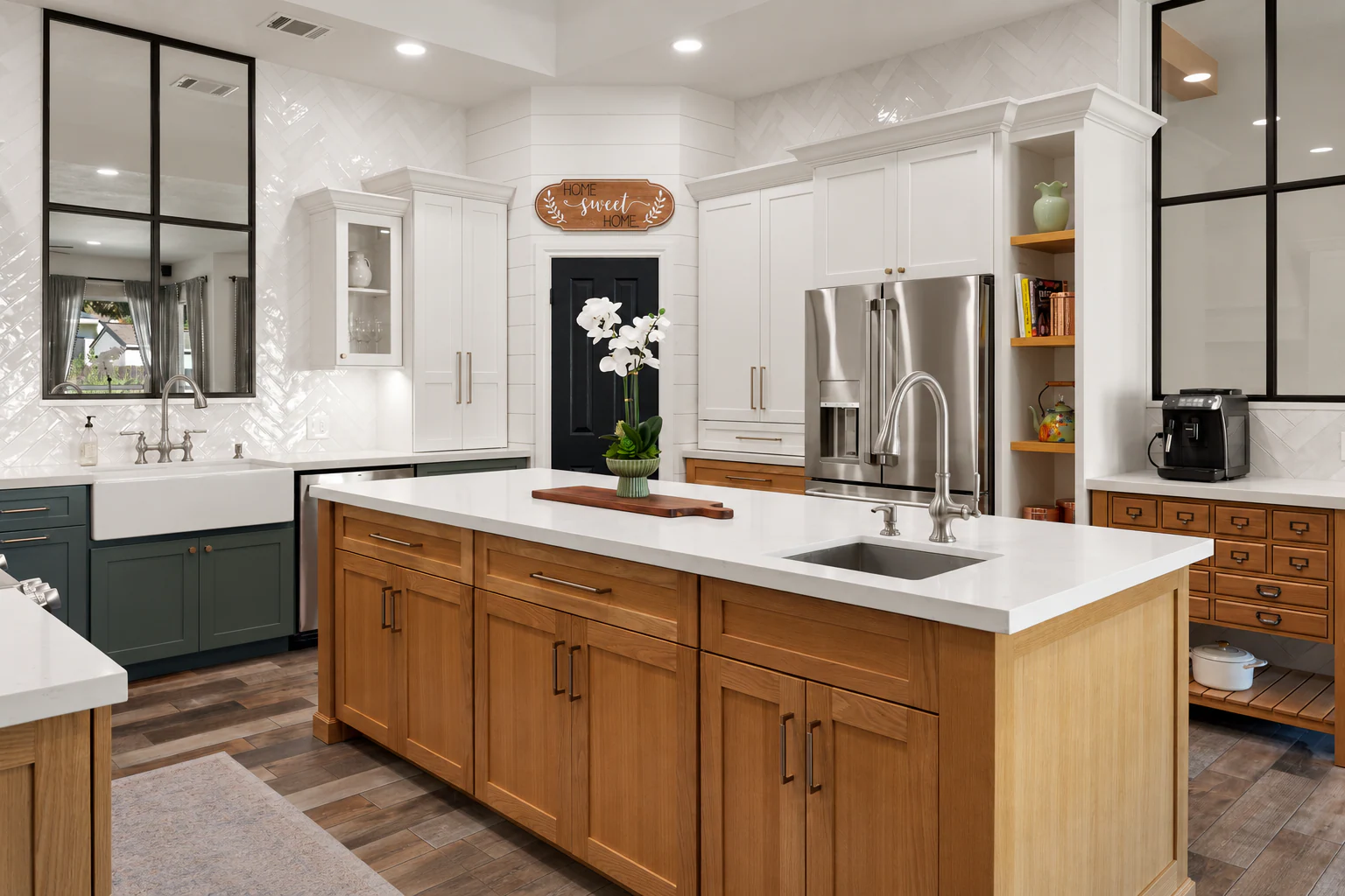 Whole-home renovation featuring a custom kitchen with a large island, white and green cabinetry, white oak accents, and an apothecary cabinet