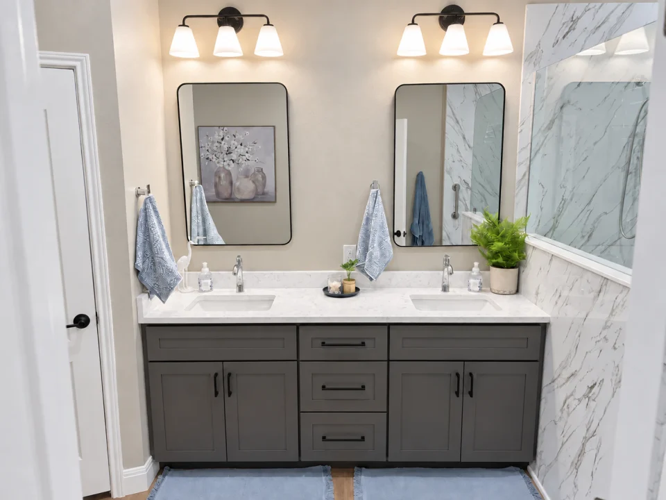 Dark double vanity with framed mirrors in the primary bathroom