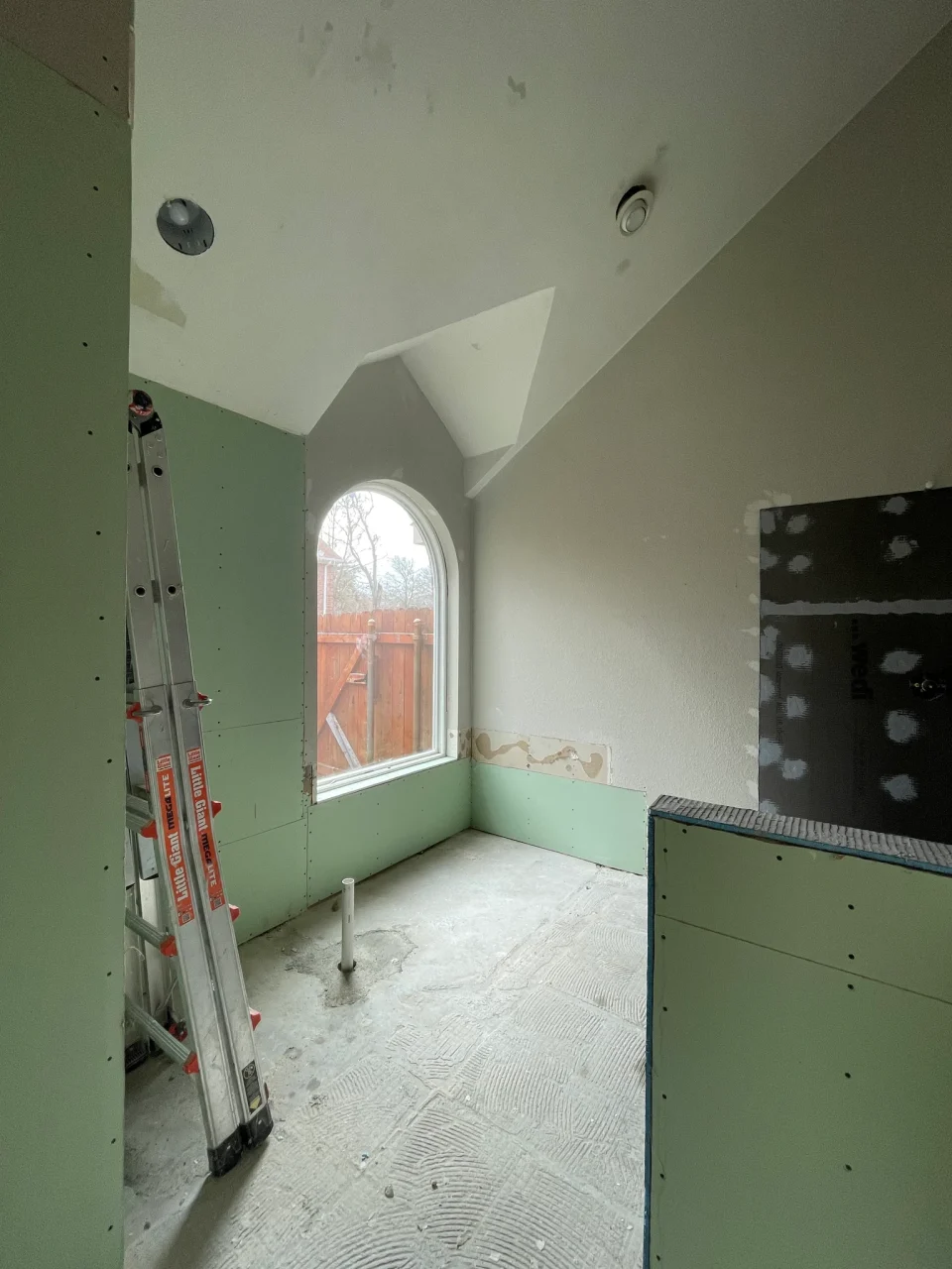 Traditional bathroom during demolition and wall preparation before tile work
