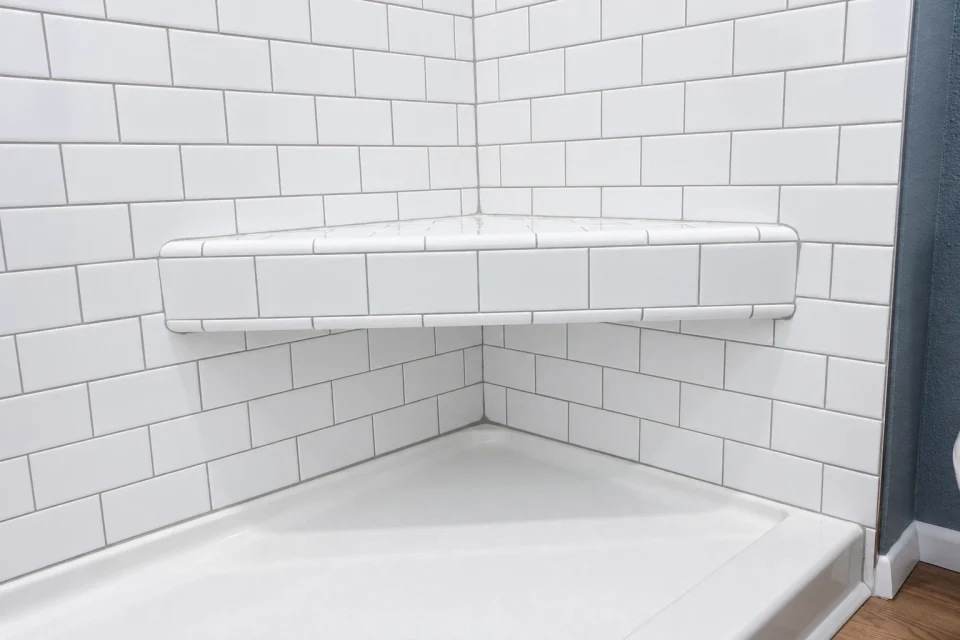Tiled corner shower bench
